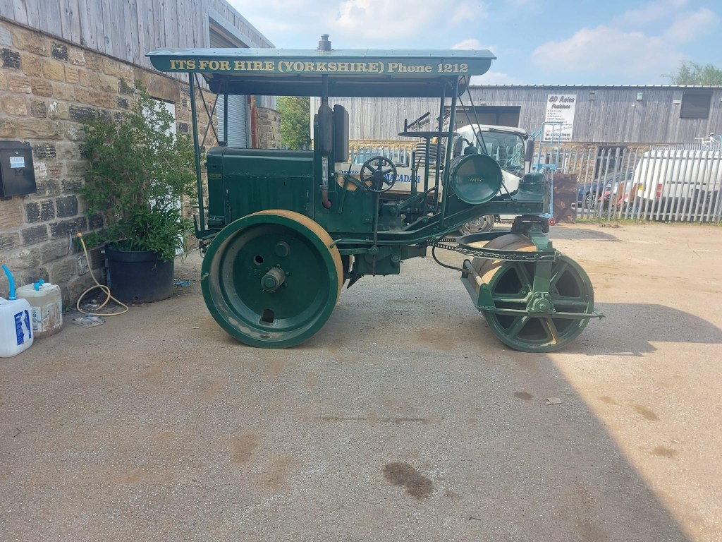Restored heritage road roller displayed at IFH Yorkshire depot.